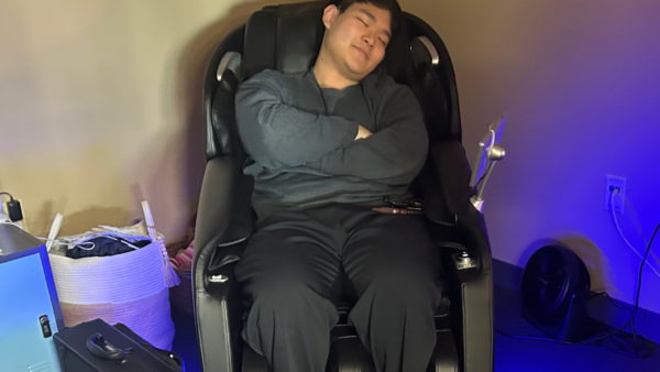 Man sitting in zen zone massage chair.